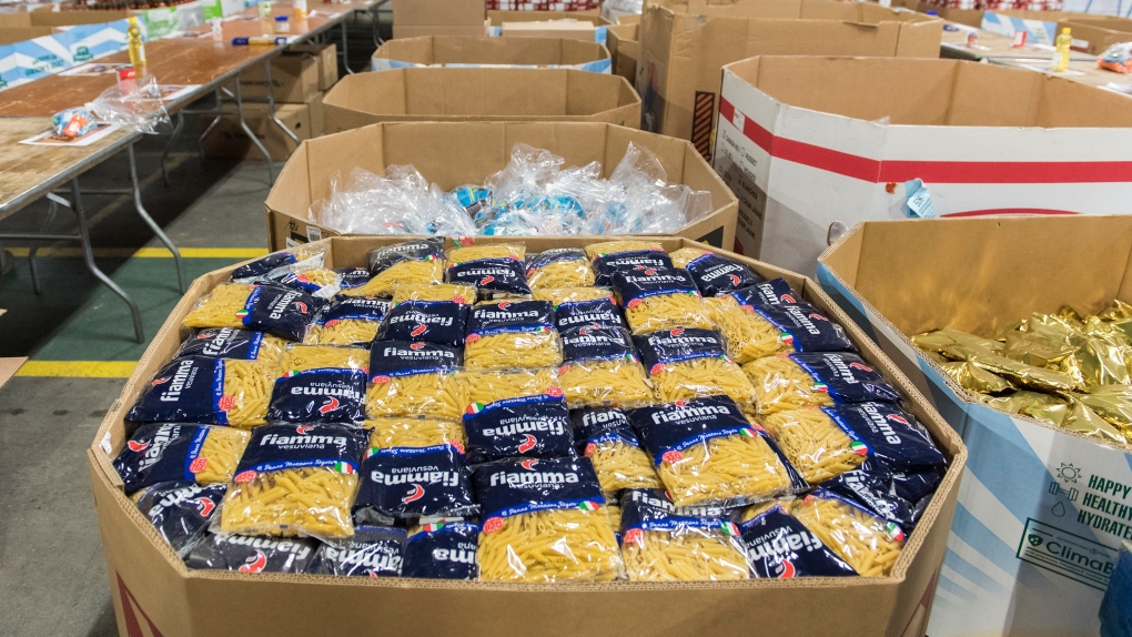 Boxes of donated food items are shown at the Moisson Montreal food bank in Montreal, Saturday, December 7, 2019. THE CANADIAN PRESS/Graham Hughes