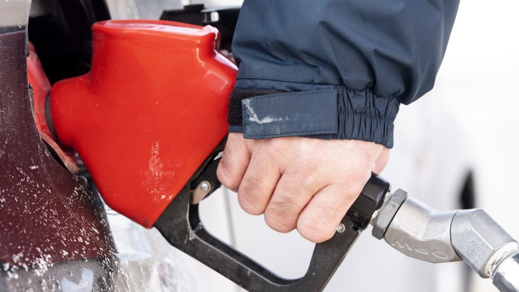 A man pumps gas in Montreal, Friday, March 4, 2022. THE CANADIAN PRESS/Graham Hughes