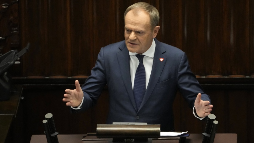 Newly elected Poland's Prime Minister Donald Tusk addresses lawmakers during his speech at the parliament in Warsaw, Poland, Tuesday Dec. 12, 2023. (AP Photo/Czarek Sokolowski)