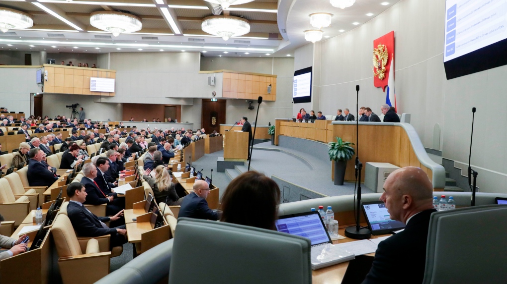 In this photo released by The State Duma, Russia's Finance Minister Anton Siluanov, right, attends a session at the State Duma, the Lower House of the Russian Parliament in Moscow, Russia, on Wednesday, Nov. 15, 2023. (The State Duma, the Lower House of the Russian Parliament via AP)